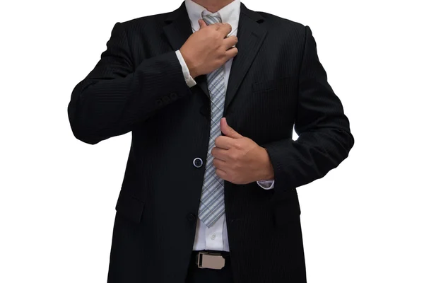 Business man in black suite adjusting necktie isolated on white — Stock Photo, Image