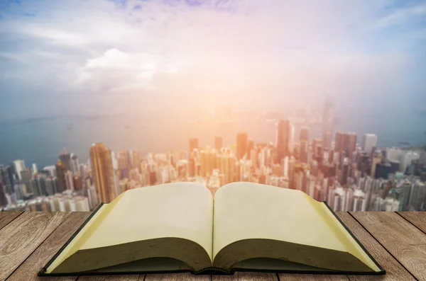 Open book with modern city background — Stock Photo, Image