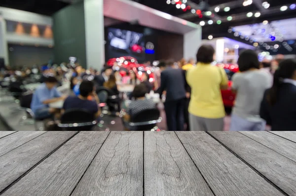 White wood table with blurred event background — Fotografie, imagine de stoc