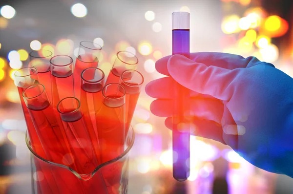 Double exposure of scientist hand holding laboratory test tube — Stock Photo, Image