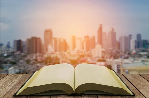 Open book with modern city background — Stock Photo, Image