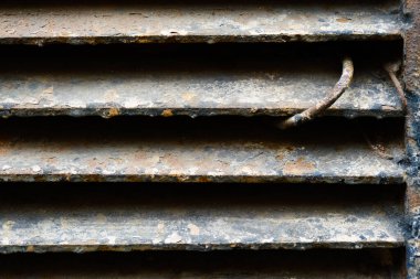 close up of rusty metal lattice wall, grunge texture, abstract brown textured lines, old iron construction isolated background, brown dirty metallic surface, material covered by rust, rough backdrop