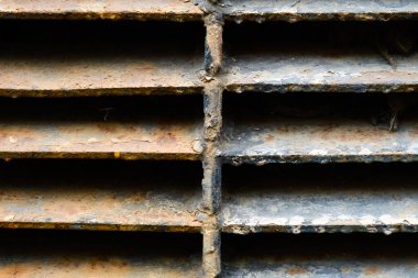close up of rusty metal lattice wall, grunge texture, abstract brown textured lines, old iron construction isolated background, brown dirty metallic surface, material covered by rust, rough backdrop