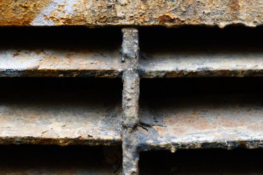 close up of rusty metal lattice wall, grunge texture, abstract brown textured lines, old iron construction isolated background, brown dirty metallic surface, material covered by rust, rough backdrop