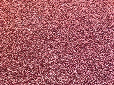 Parktaki kırmızı ve kahverengi yol. Spor ve oyun alanlarını korumak için. Duvar kağıdı ve arkaplan için.