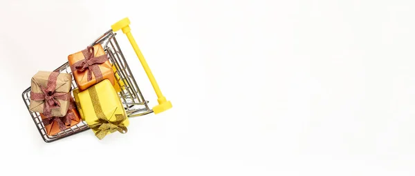 Shopping Cart Trolley Full Gift Boxes Yellow Orange Colorful Paper —  Fotos de Stock