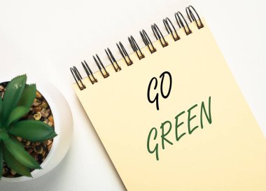 Ofis defterine çiçekli yeşil kelimeler yaz..