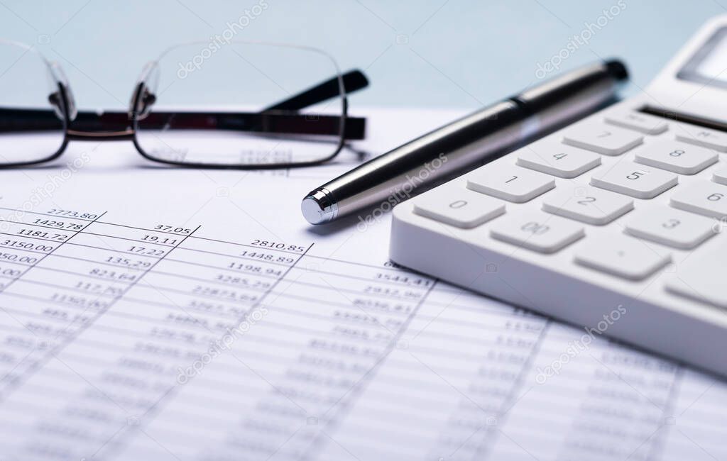 Business financial documents with calculator. Accounting concept.
