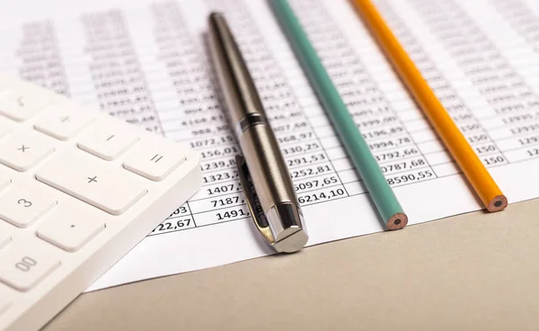 Calculator with documents on table. Paperwork and finance