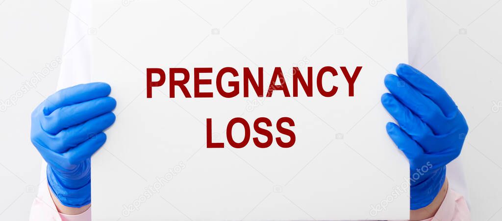 Pregnancuy loss concept, inscription. Miscarriage word, problem