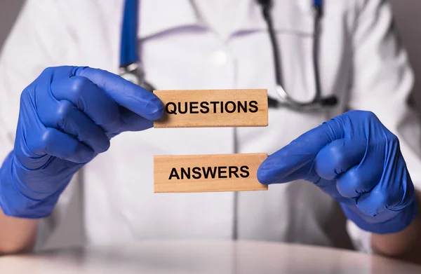 Questions and answers, q or qa concept, inscription in doctor hands.