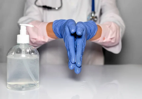 Doctor Hands Blue Gloves Cleaning Washing Hands Sanitizer Bottle Close — Stock Photo, Image