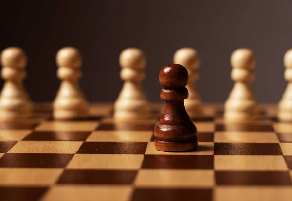 One unique pawn outstanding from many opposits. Concept of individual, different, standout, original — Stock Photo, Image