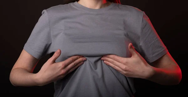 Woman touching, examining her breast. Self screening, examination and detection