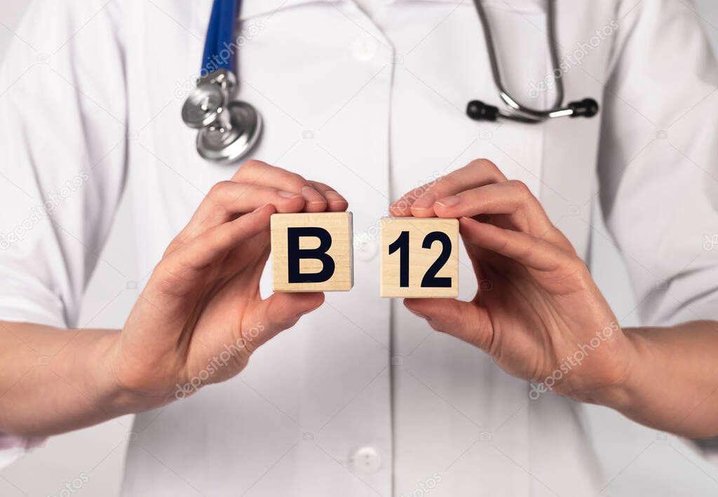 B12 vitamin supplement inscription on wooden cubes. Medical prescription.