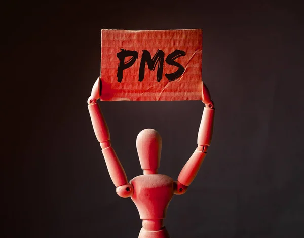 Sigla PMS, inscripción del síndrome premenstrual en luz roja —  Fotos de Stock
