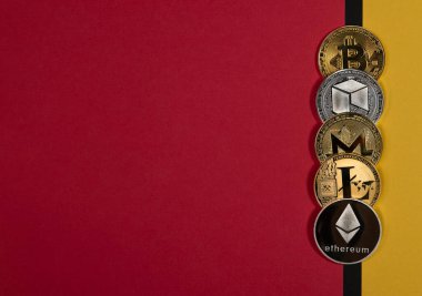 Shining crypto currency coins, cryptocurrency banner on yellow and red banner with copyspace for text