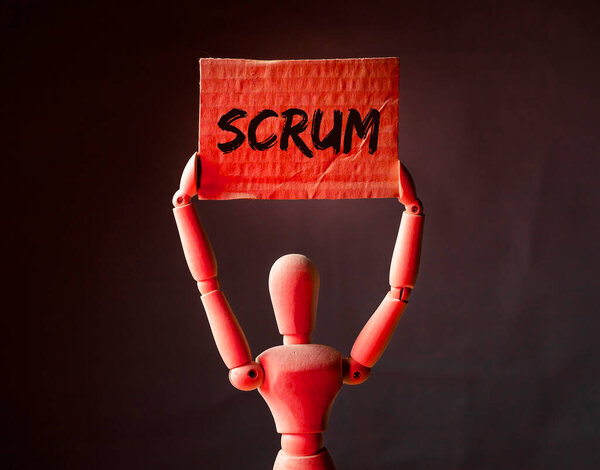 Слово на плакате в руках деревянного бизнесмена. Концепция методов управления