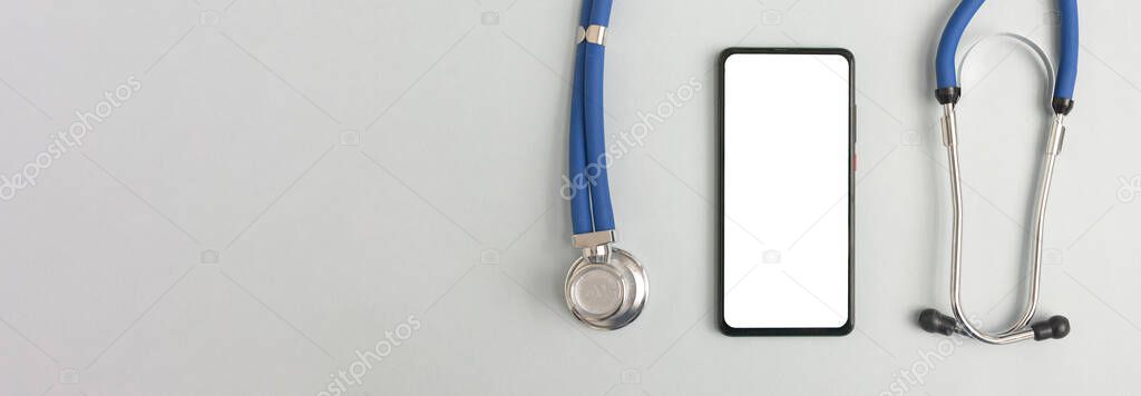 Mobile phone mockup for medical app. Smartphone white screen mockup and stethoscope for health application. Banner with copy space for text