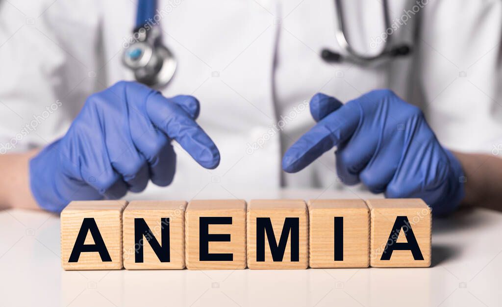 Anemia word on wood cube blocks on doctor table