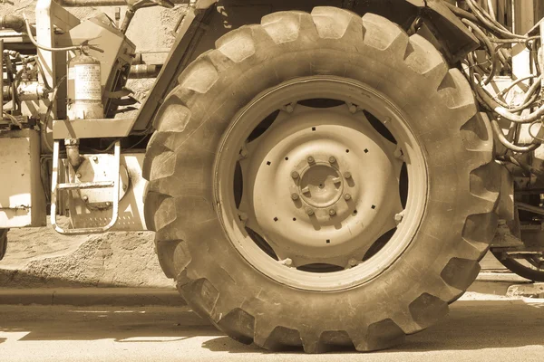 Driving wheel in old tractor Stock Photo