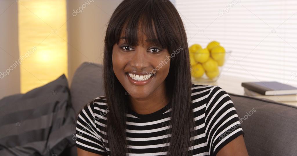 Pretty black woman smiling in striped shirt