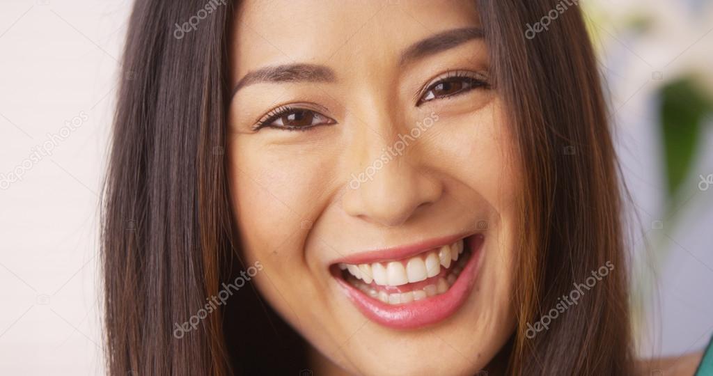 Cute Japanese woman smiling and laughing