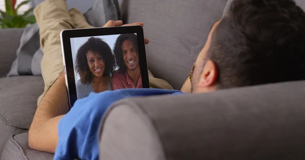 Puerto Rican friends talking on tablet — Stock Photo, Image