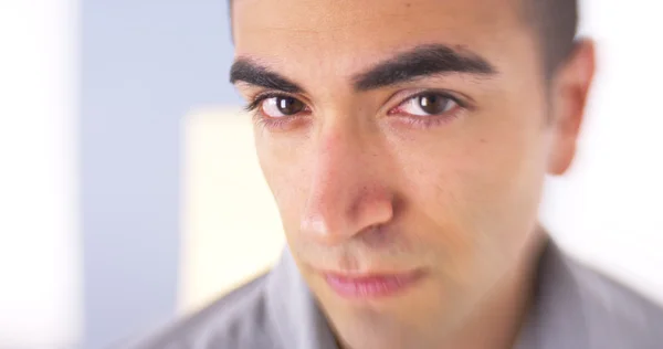 Succesful Mexican man standing by window — Stock Photo, Image