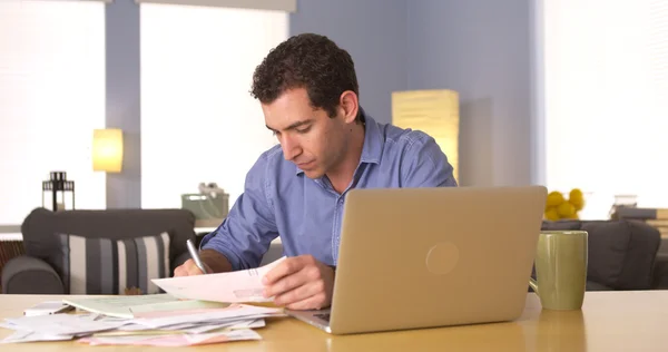 Man doing his taxes at desk — Stock Photo, Image