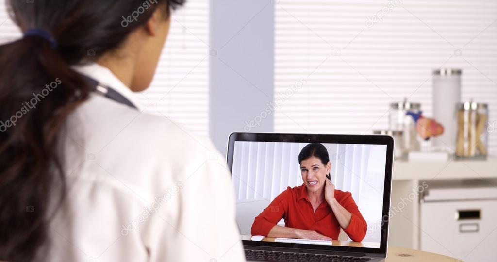 Elderly patient video chatting with doctor