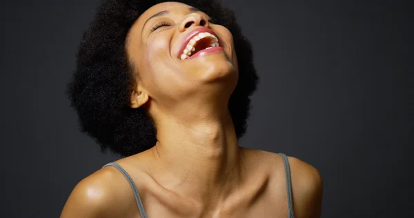 Slow pan up casual black woman laughing and smiling — Stock Photo, Image