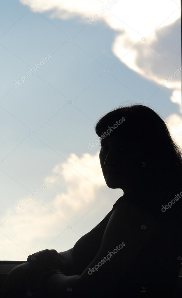 silhouette of a girl at the window