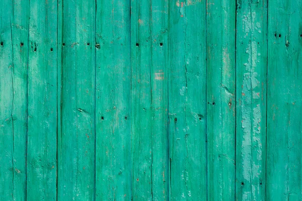 Oude groene gebarsten verf op houten achtergrond — Stockfoto