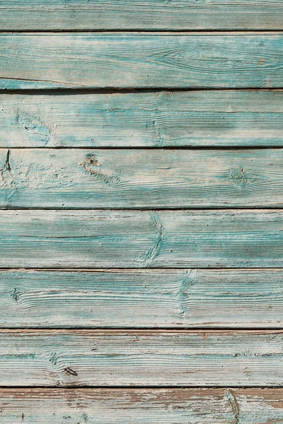 Antigua pintura agrietada azul sobre fondo de madera — Foto de Stock
