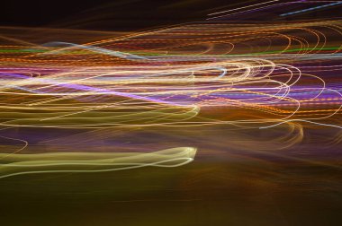 Süslü, renkli neon işaretler - düzensiz ışık çizgileri ile soyut arkaplan.