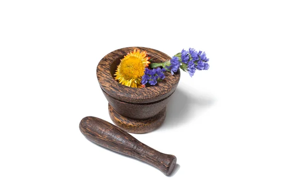 Wooden pounder with yellow and blue flowers — Stock Photo, Image