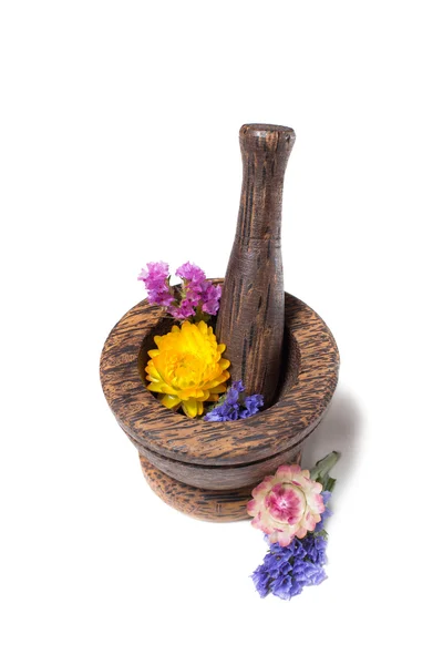 Wooden pounder with yellow and blue flowers — Stock Photo, Image