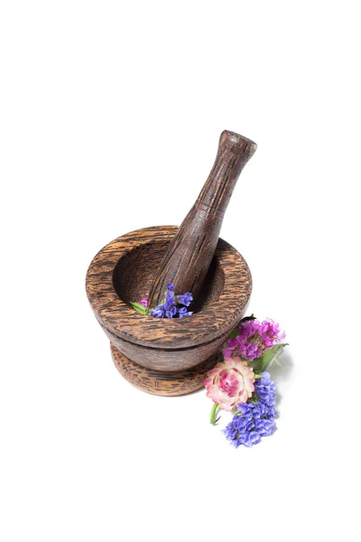 Wooden pounder with yellow and blue flowers — Stock Photo, Image