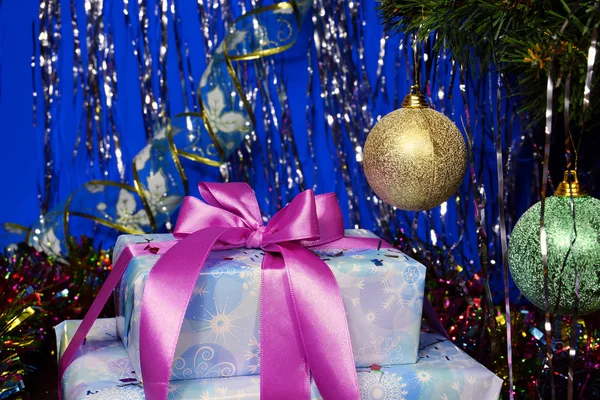 New Year's gift under a Christmas tree — Stock Photo, Image