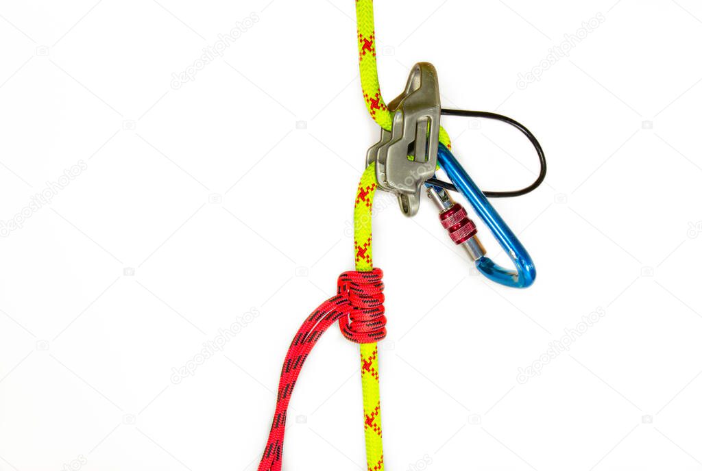 System classic dulfer using belay equipment ATC, isolated on white background. Sport equipment designed for self descent on a rope. Climbing gears it consists of rappel device, knot prusik, carbine