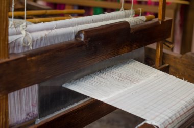 Silk on the loom. clipart