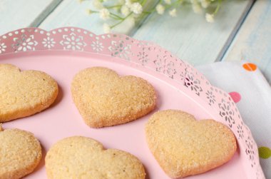 Heart-shaped butter cookies with sugar. clipart