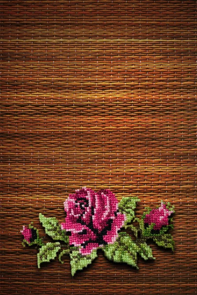 Rose on straw background — Stock Photo, Image