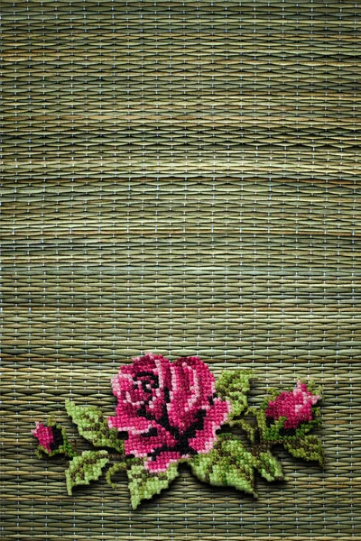 Rose on straw background — Stock Photo, Image