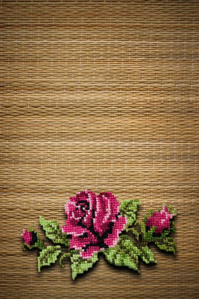 Rose on straw background — Stock Photo, Image