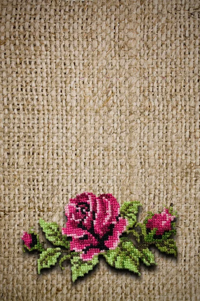 Rose on canvas background — Stock Photo, Image