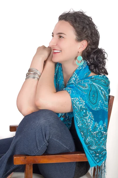 Young woman on chair smiling — Stock Photo, Image