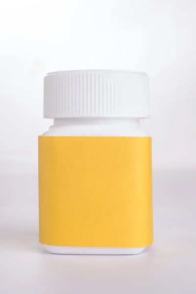 Sarı etiketli beyaz kapsül tutucu — Stok fotoğraf