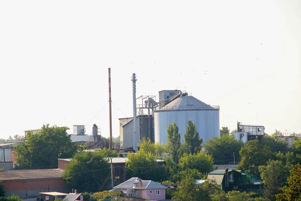Small factory on the background of the cityscape